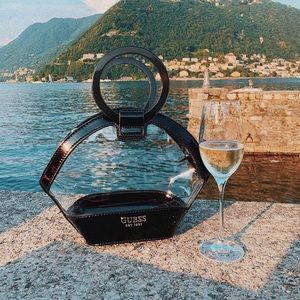 Lovely Guess clear bag and black cosmetics bag